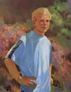 Young man in blue t-shirt with hand on hip